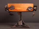 an art nouveau lamp with a bronze base and two birds on it