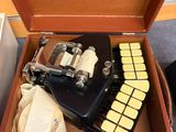 an old typewriter sitting inside of a wooden box