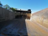 a train that is going down the tracks in the tunnel