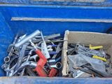 a box full of wrenches and other tools in it