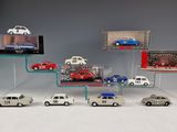 a lot of cars that are on display in a display case