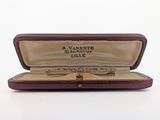 a pen in a case on a white surface