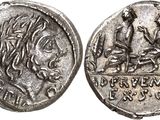 a silver coin with an image of a man and a woman on it