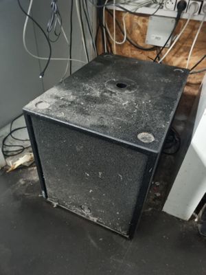 a small black box sitting on the floor in a room
