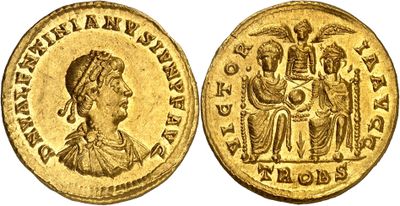a gold coin with an image of a woman and a man on it