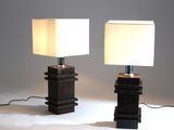 two lamps that are sitting on a table