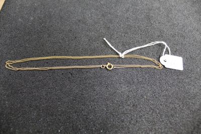 a close up of a gold chain with a tag on it