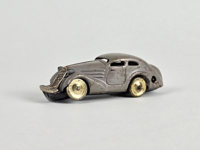 a toy car that is sitting on a white surface
