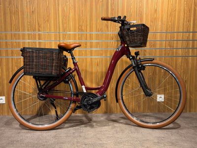 a red bicycle with a basket on the back