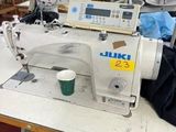 an image of a sewing machine in a factory