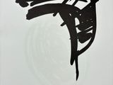 a black and white drawing of a bird on a branch