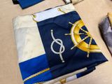 a blue and white cloth with a ship ' s wheel on it