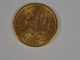 an image of a gold coin on a white surface