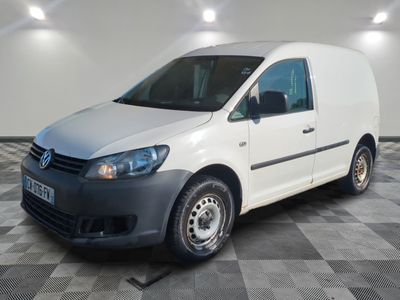 the white van is parked on a checkered floor in a room