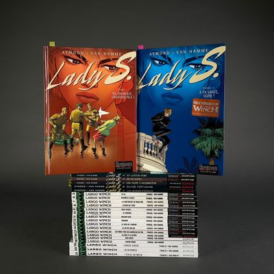 a lot of books that are sitting on a table