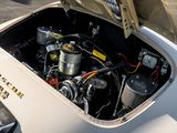 a close up of a car ' s engine with its hood open