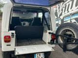 a white van with a bike in the back of it