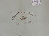 a close up of a white plate with writing on it
