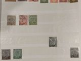 an old picture of a picture of a collection of stamps on display