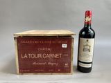 a bottle of red wine next to a wooden box