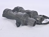 a pair of binoculars sitting on a white surface