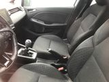 the interior of a car with black seats and a steering wheel
