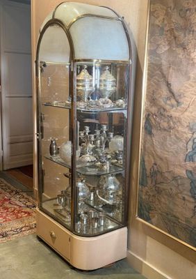 a glass display case in the corner of a room