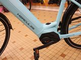 a blue bicycle that is on display in a store