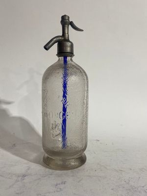 an old fashioned glass bottle with a blue line painted on it