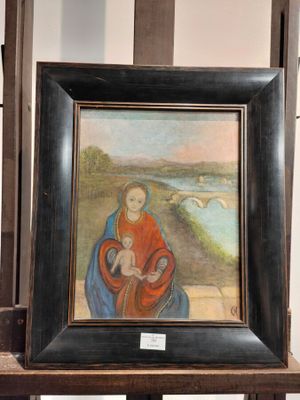 a painting of a woman holding a child on a table