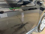 a close up of a car door with a sticker on it