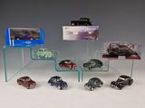 a lot of cars that are on display in a display case