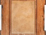 an old wooden picture frame with a piece of wood sticking out of it