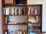 a bookshelf with a bunch of books on it