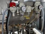a machine that is sitting in a room with a lot of equipment