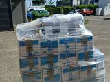 a pallet full of water sitting in a parking lot