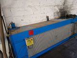 a blue machine that is sitting in a room