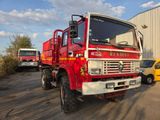 a red fire truck parked in front of a building