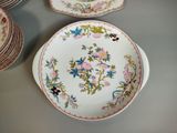 many plates that are sitting on a table