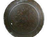an overhead view of a metal plate on a white background