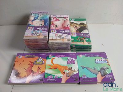 several children ' s books sitting on top of each other on a table