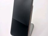 a cell phone that is sitting on top of a stand