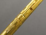 an image of a pen with a gold finish on it
