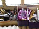 two boxes that have various items in them on the floor
