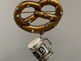 a pretzel and a mug hanging from a string