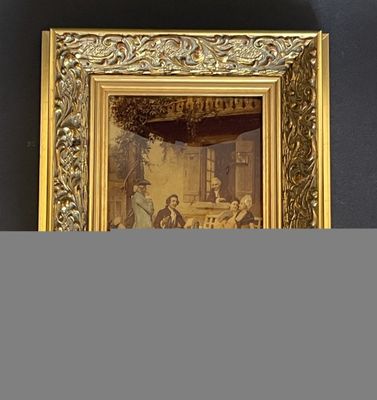 une vieille photo représentant un homme et une femme assis à une table devant une fenêtre