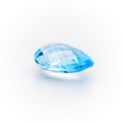 a close up of a blue diamond on a white background