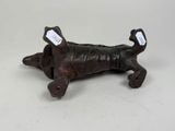 a dog figurine that is sitting on a table