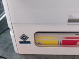 a printer that is sitting on the floor next to a mouse