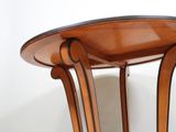 a wooden table with a glass top on a white floor